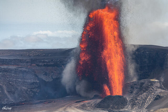 Explosive lava fountain erupting from Kilauea volcano with molten rock spraying into the air.