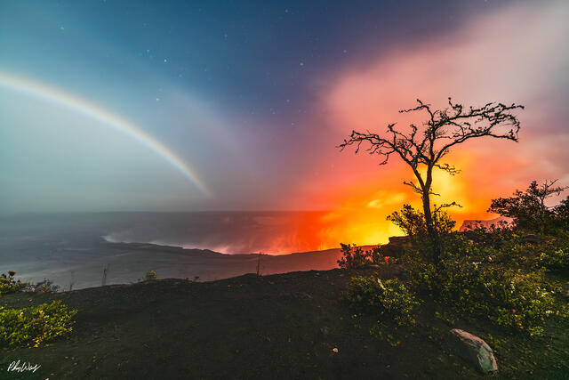 Double moonbow over Kilauea lava with glowing volcanic light on the Big Island of Hawaii.