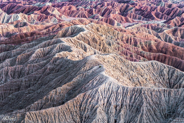 Eroded desert ridges forming layered lines in Anza Borrego California.