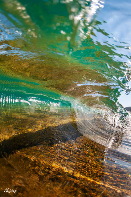 Close up view inside a breaking reef wave on the North Shore of Oahu.