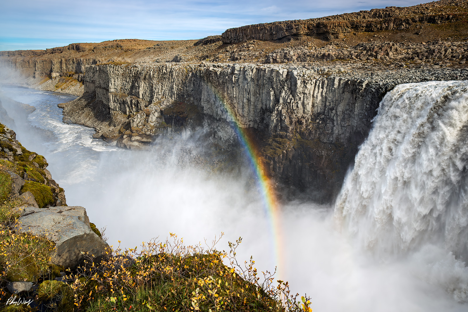 Chase the Rainbow Rainbow forming in mist at Gullfoss waterfall Iceland.