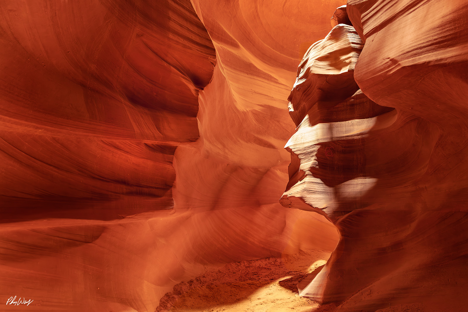 Stone Faces Sandstone formations resembling faces inside Antelope Canyon Arizona with warm red light.