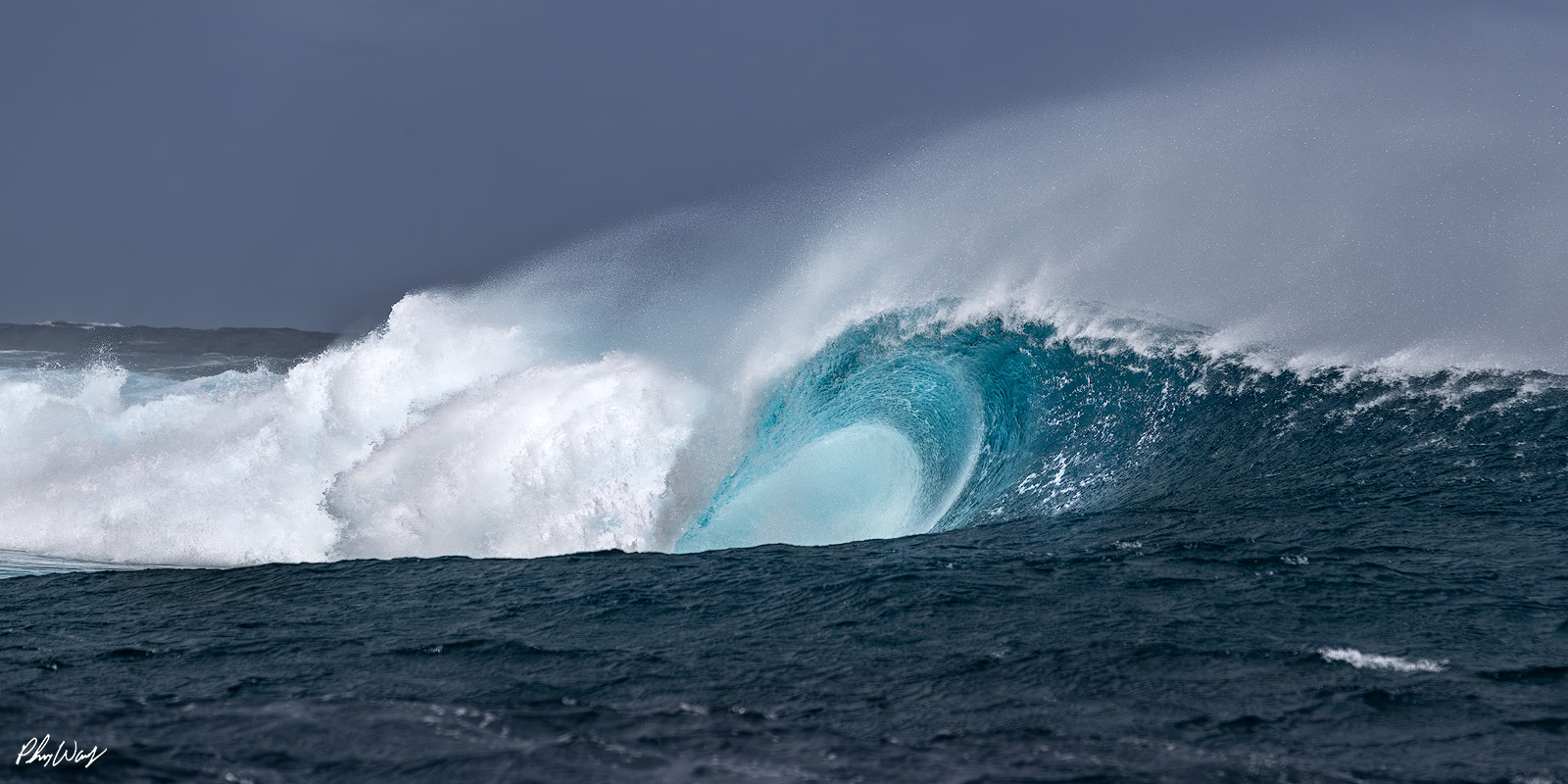 Teahupoo Wave Powerful ocean wave forming a hollow barrel at Teahupoo in Tahiti.