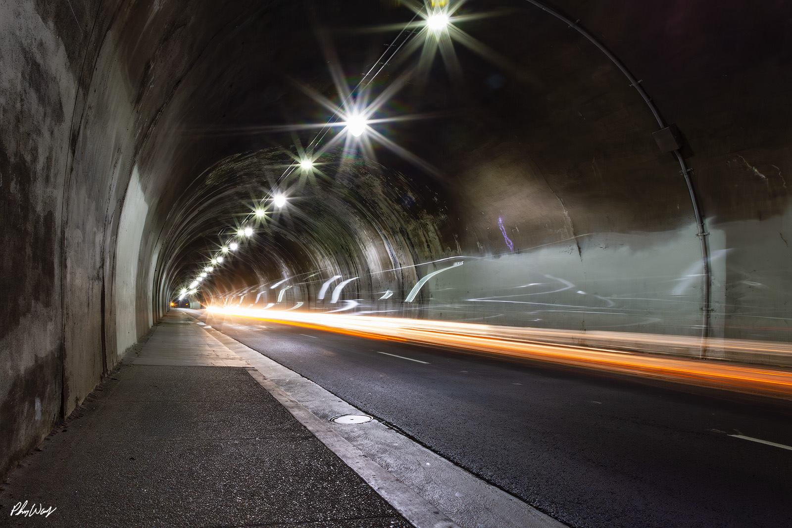 Los Angeles Tunnel Lines Long exposure photograph of light trails inside a downtown Los Angeles tunnel at night.