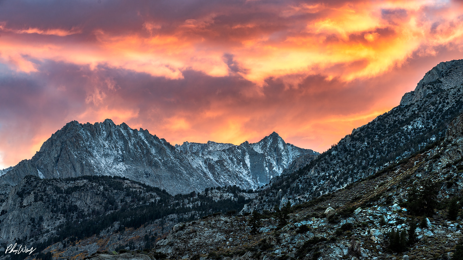 Sunset Over Sabrina Mountains Fiery sunset clouds above rugged Sabrina Mountains in the Eastern Sierra, California.