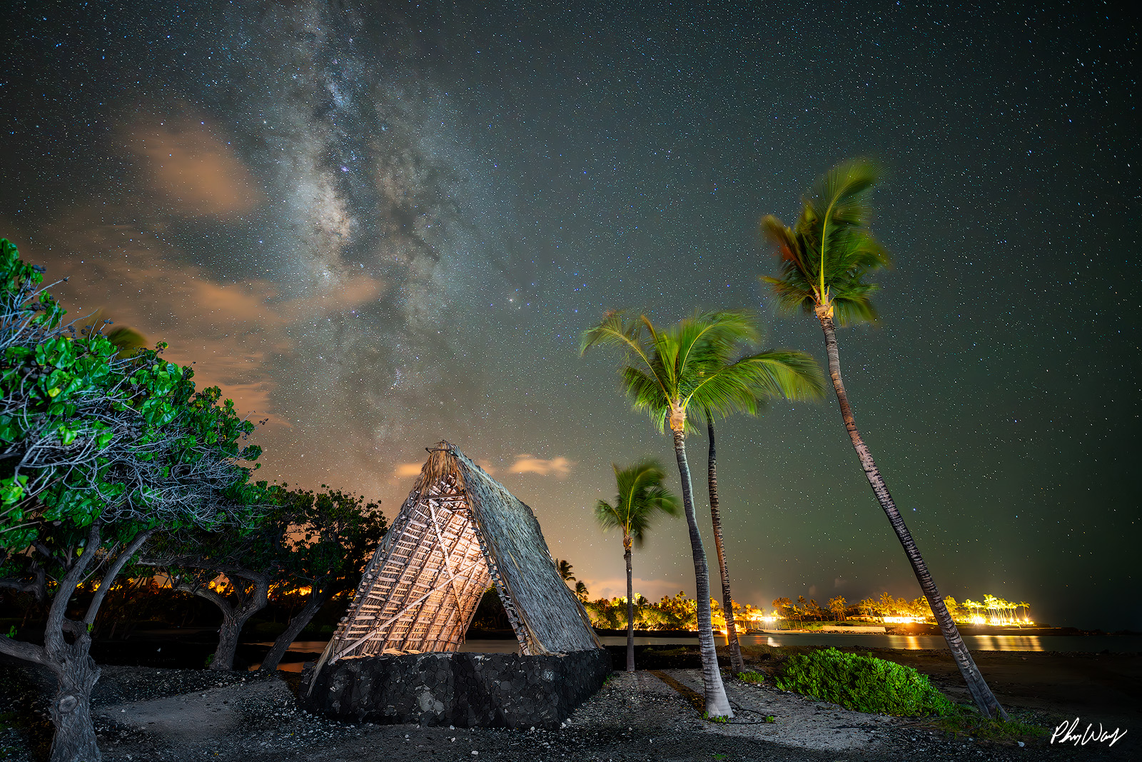 Hale and Milky Way Traditional Hawaiian hale beneath the Milky Way with palm trees at night in Mauna Lani on the Big Island of Hawaii.
