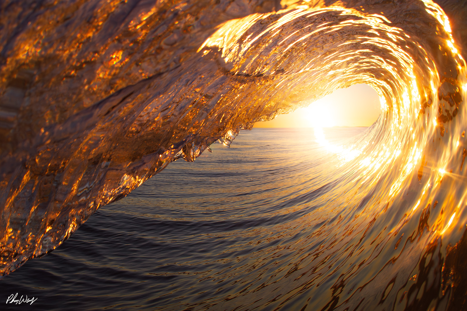 Ventura County Wave Crest Golden sunrise light illuminating the crest of a curling ocean wave in Ventura County, California.